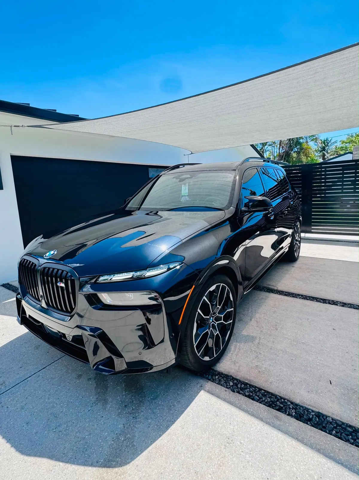 Black BMW X7 with a deep gloss finish after polishing